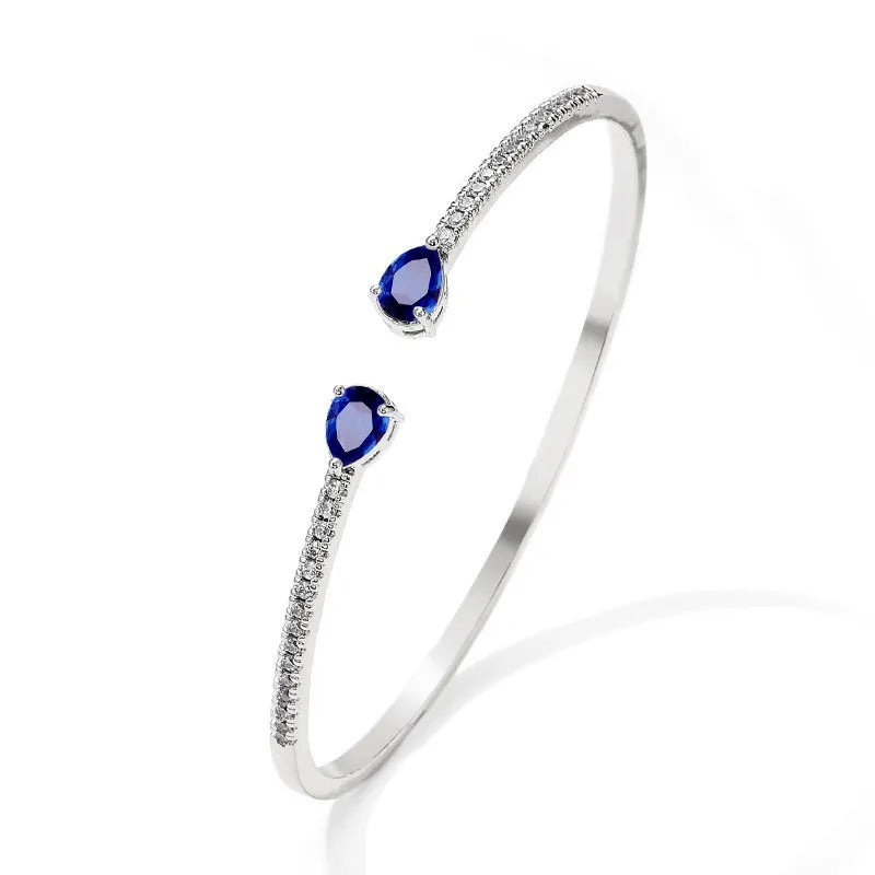 Copper personalised bracelet with multi-zircon inlaid design in simple style, shown in blue and white colour options.