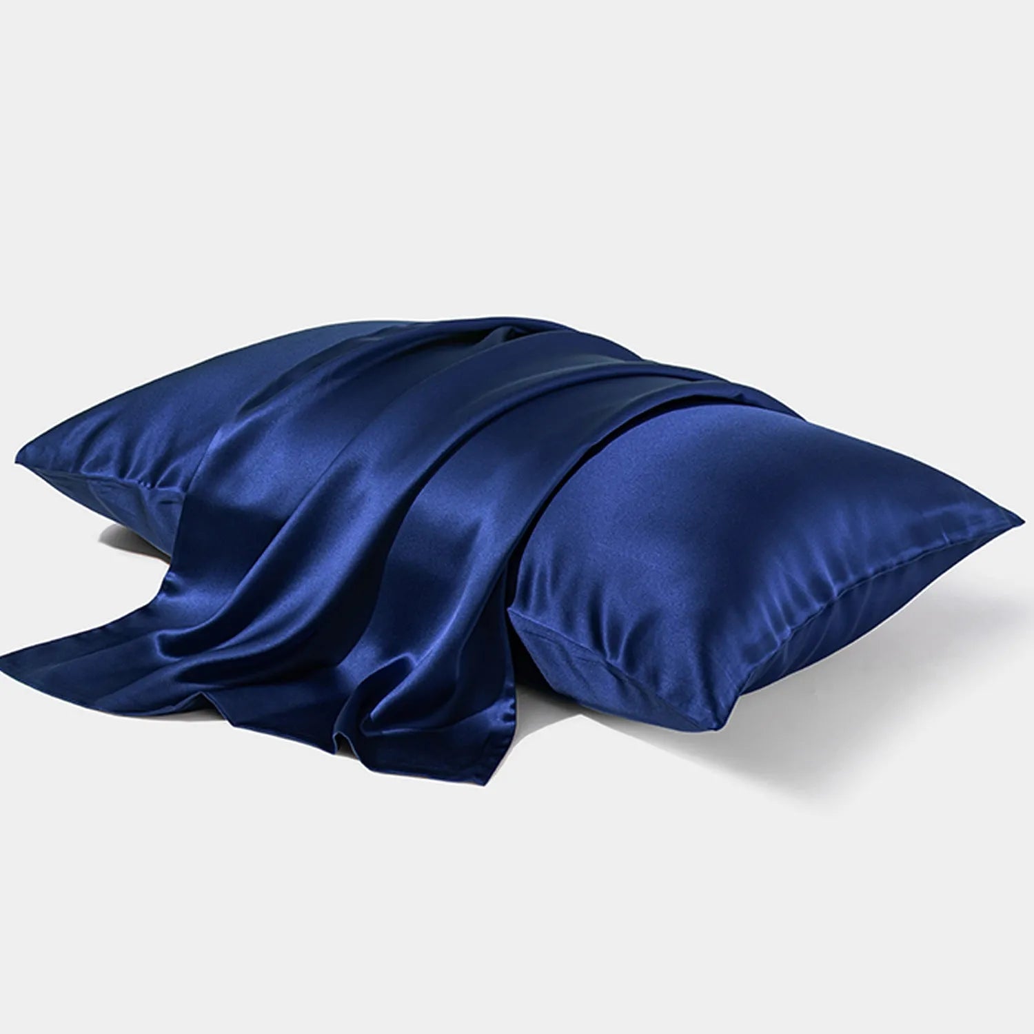 Dark gray envelope closure silk pillowcase on a bed