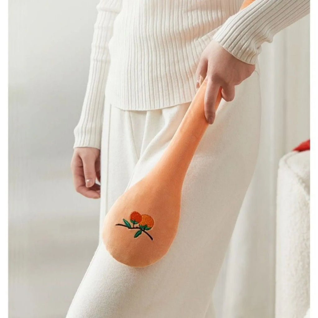 48 cm long persimmon coloured percussion massage stick with meridian flap design in a zipper case.