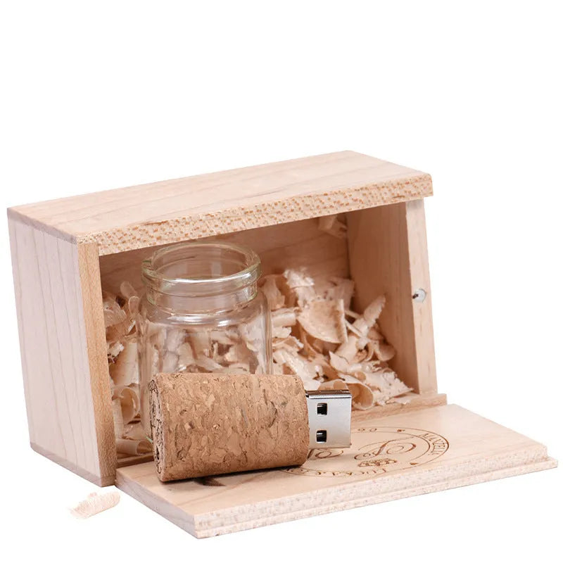 Personalised wooden drift bottle-shaped USB flash drive showing custom graphic on its side.