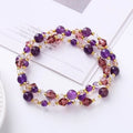 Three-ring crystal bracelet with tourmaline, strawberry quartz and amethyst stones on adjustable tightening rope