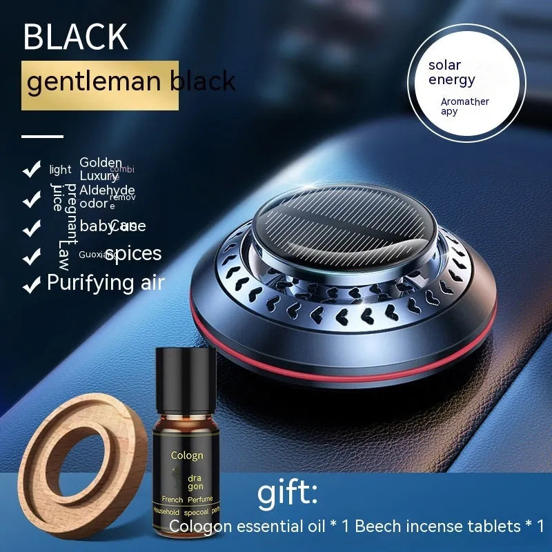 Solar-powered aluminium alloy car air freshener diffuser in black colour on a car dashboard.