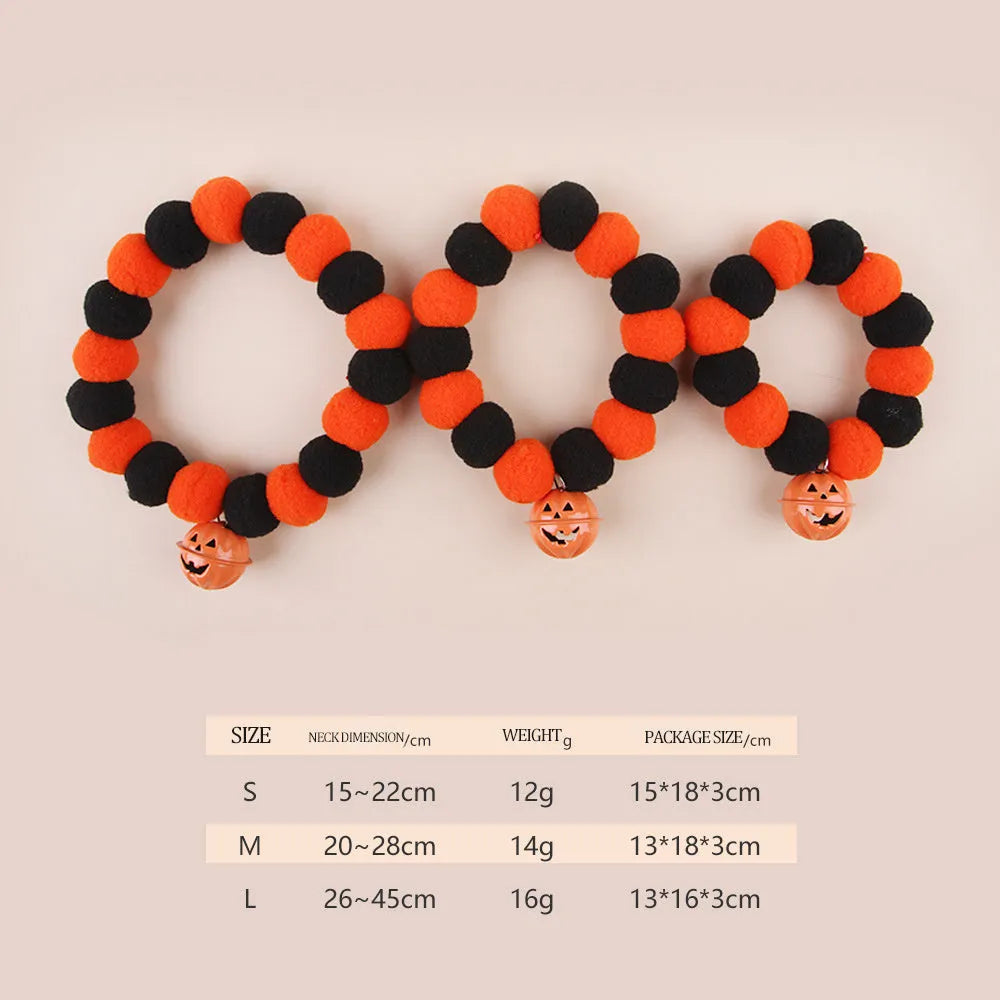 Orange Halloween cat collar with black pumpkin face design and a black adjustable buckle.