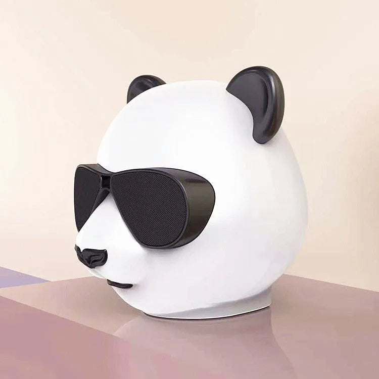 Portable mini Bluetooth speaker with classic styling showing front speaker grill and control buttons