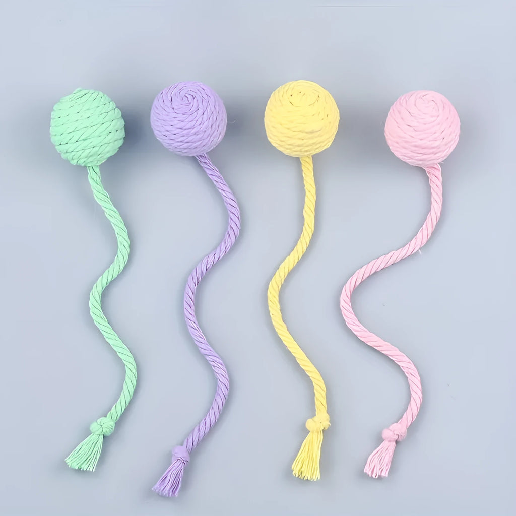 Interactive cat toy ball with rope attachment and built-in bell in green, pink, purple and yellow colours