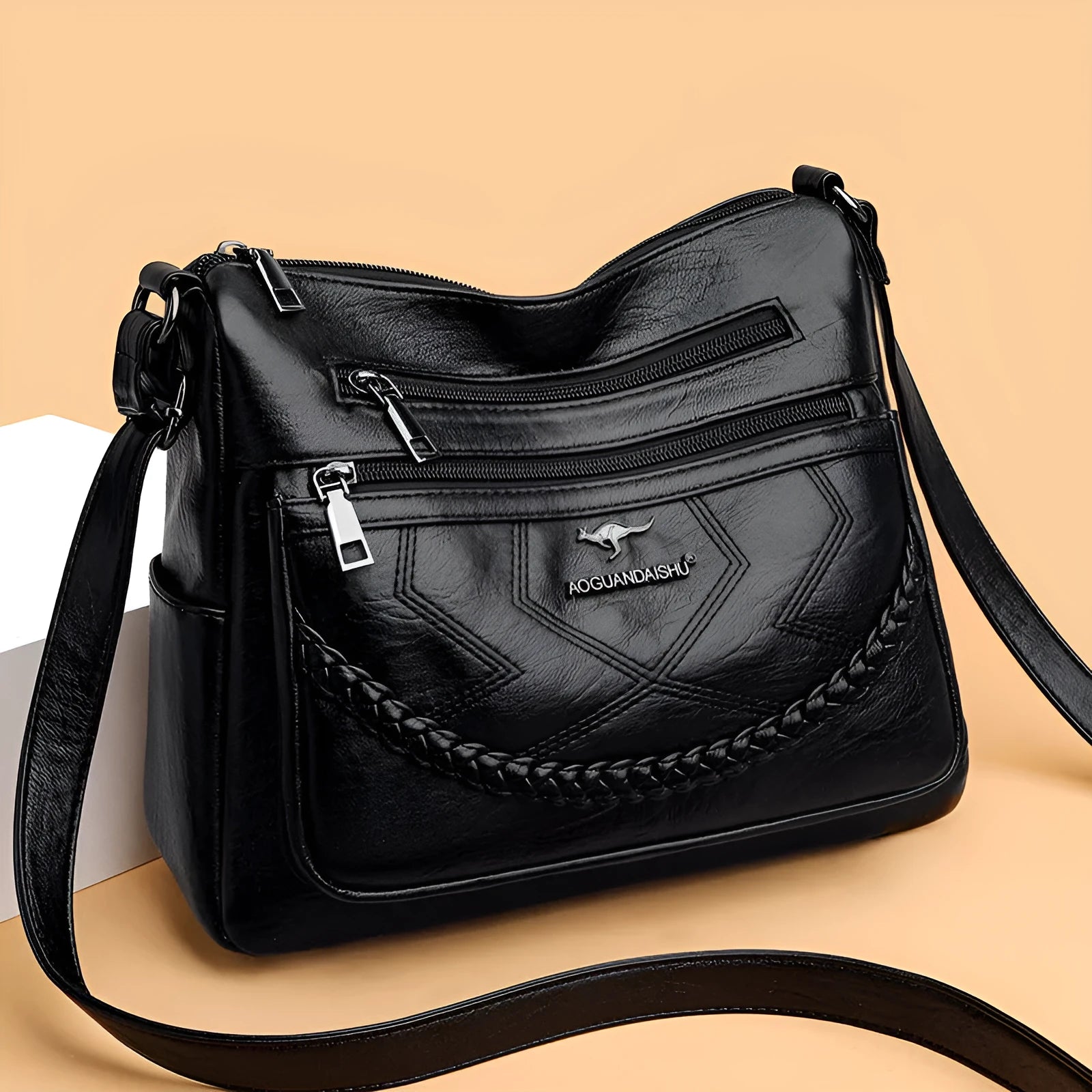 Soft PU leather shoulder bag in horizontal square shape, shown in one of four colours with crossbody strap