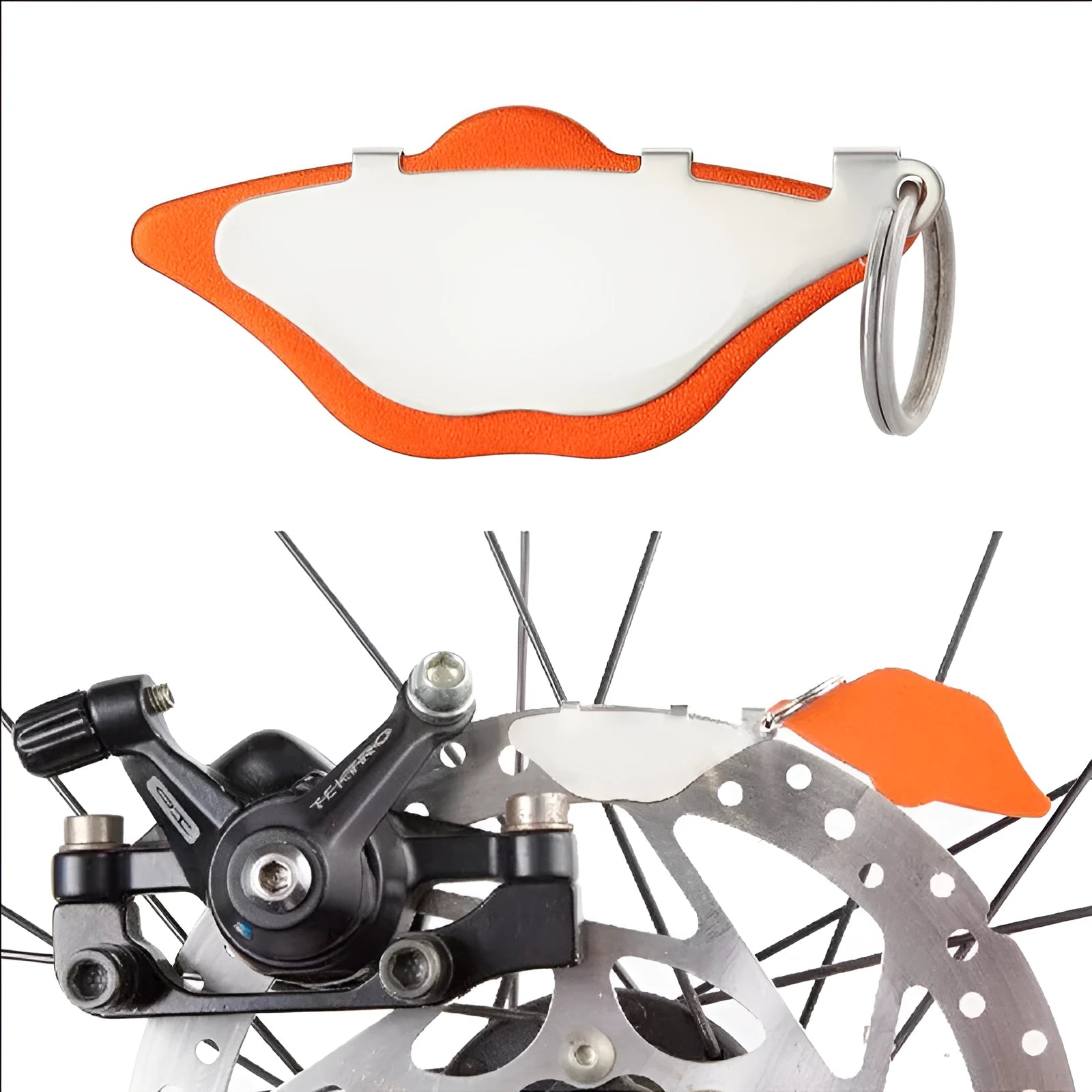 Black and orange metal mountain bike disc brake linings with adjustment flap for brake maintenance
