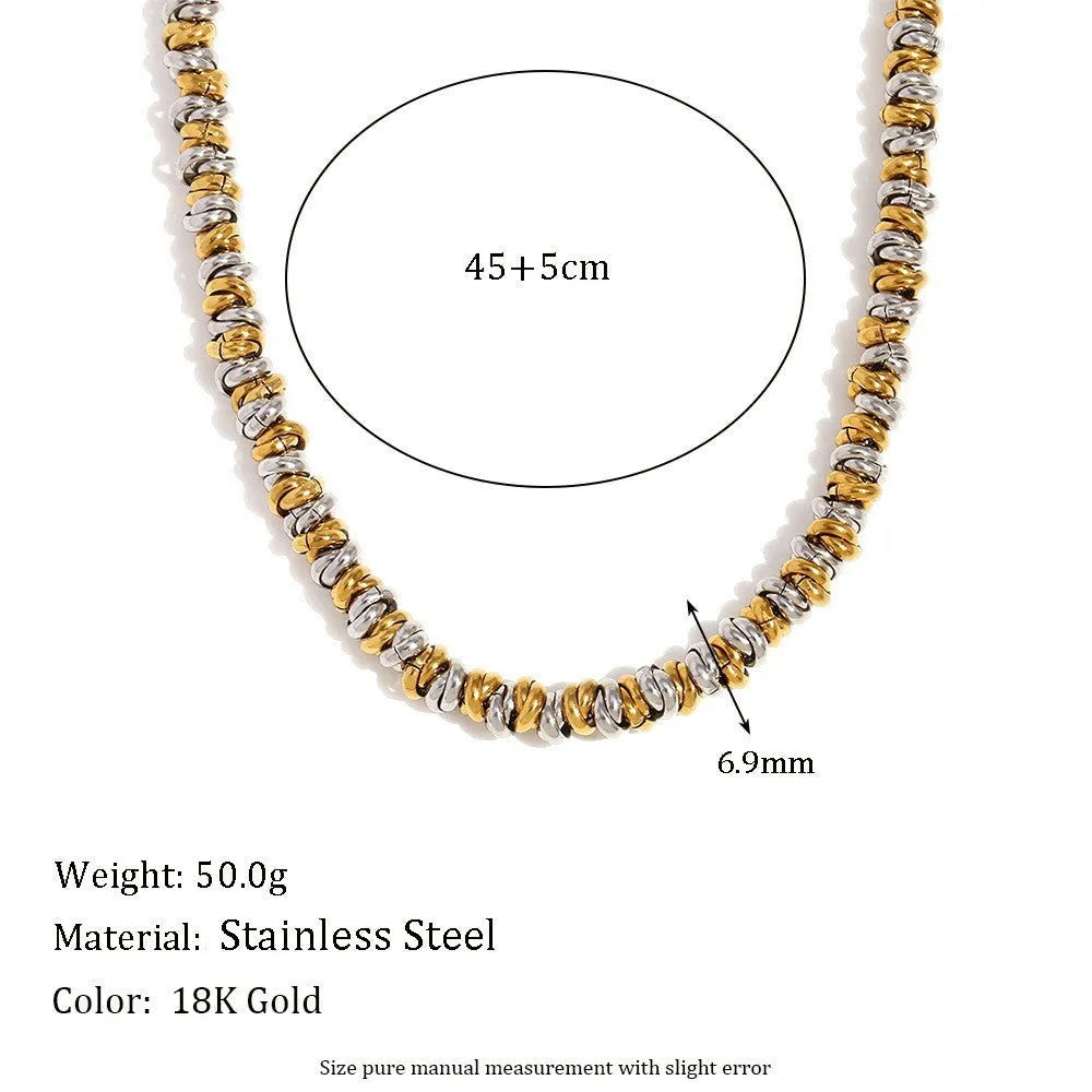 Gold tone geometric jewellery set including earrings, bracelet and necklace with round ring design elements