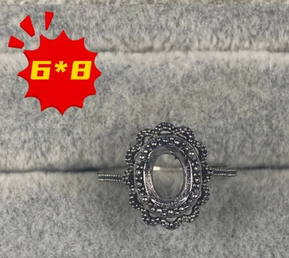 Copper oval denier ring with a 6x8 mm five-pointed star and open mouth setting.