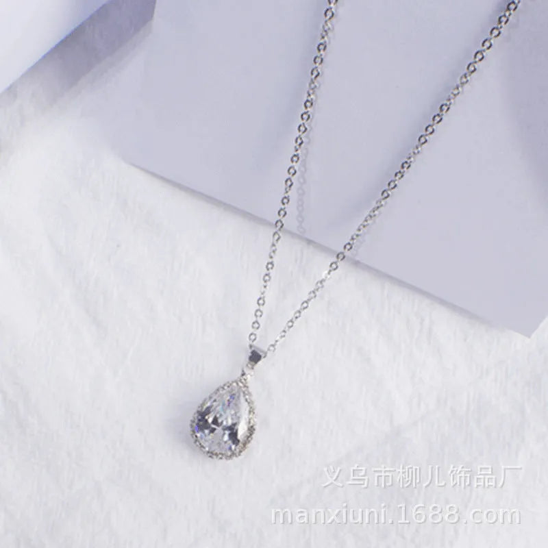 Drop shape geometric pendant necklace with rhinestone inlay in pink rose gold electroplated finish