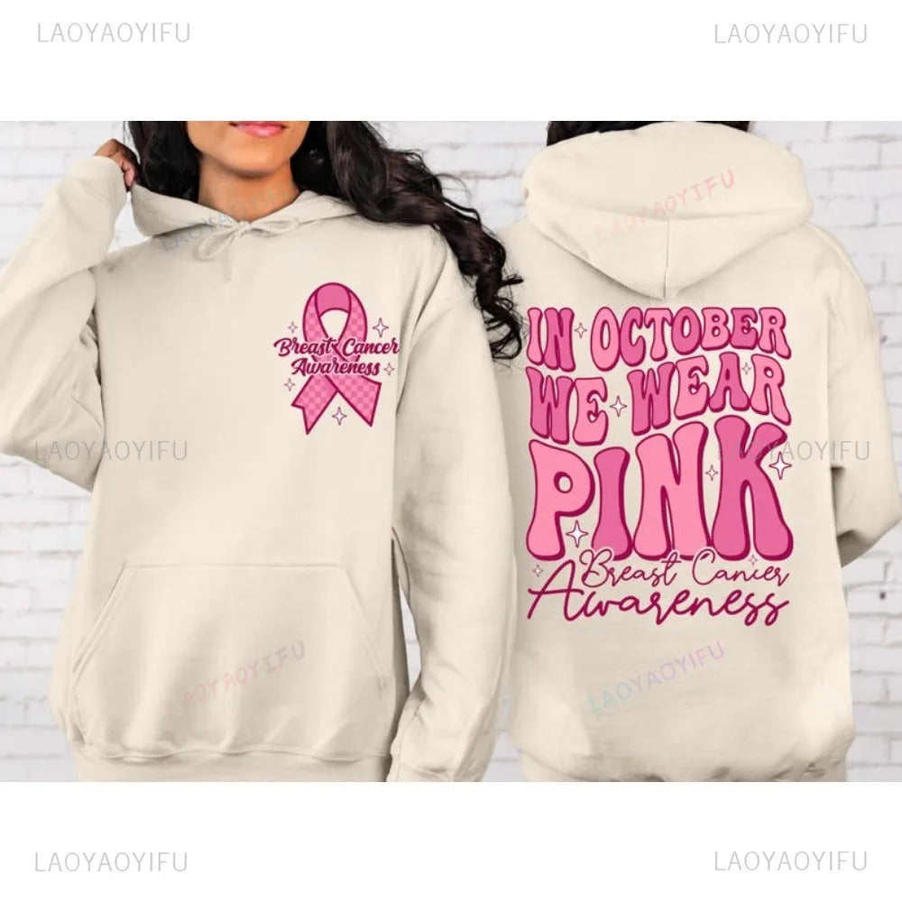 Breast Cancer Awareness pullover hoodie with retro art print and side seam pockets, shown in pink.