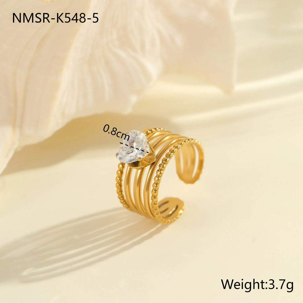 Women's geometric stainless steel ring with gold plating and inlaid zircon stones, shown in an open mouth free size design.