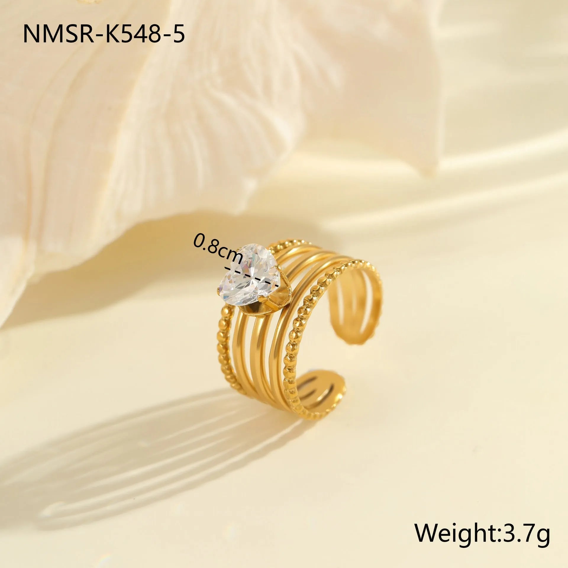 Women's geometric stainless steel ring with gold plating and inlaid zircon stones, shown in an open mouth free size design.