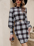 Black women's tight dress with lantern sleeves and leather stitching detail in mid-length design