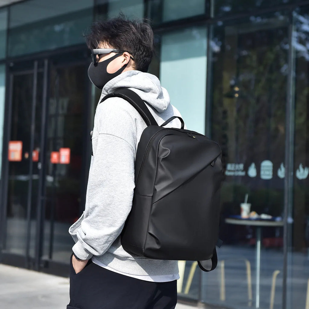 Waterproof black PU leather backpack with sewing thread details and large capacity storage