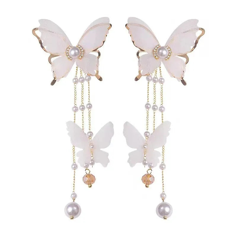 White butterfly earrings with tassel lace, pearl and rhinestone decorations on copper alloy
