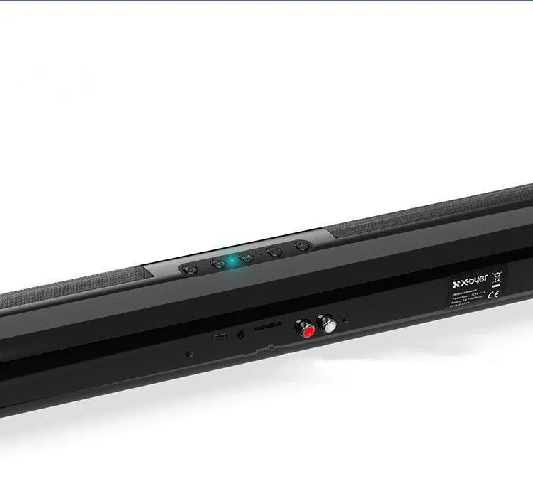 Tall black Bluetooth sound bar speaker with remote control on a wooden surface