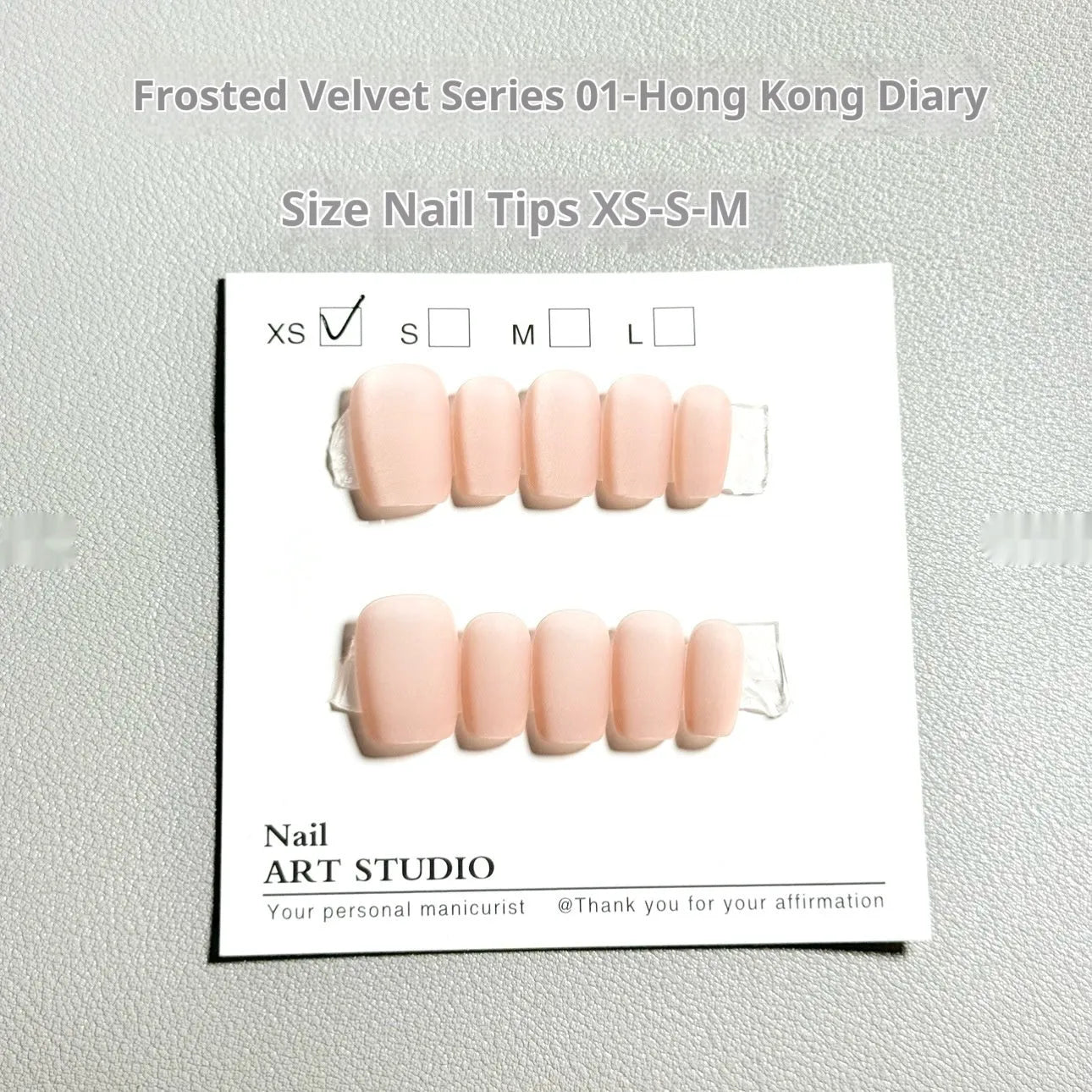 Frosted velvet cat's eye false nails with aurora electroplated finish showing short ladder sizing