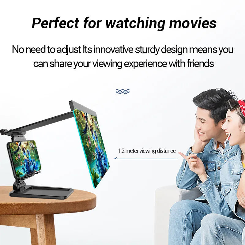 Black folding mobile phone screen magnifier with detachable holder on a desk