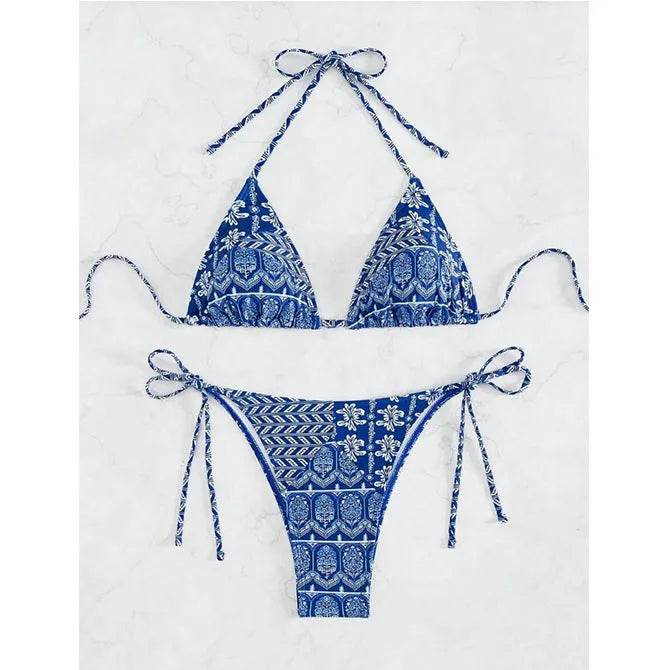Women's green bandage style bikini swimsuit with split stitching detail on polyester fabric.