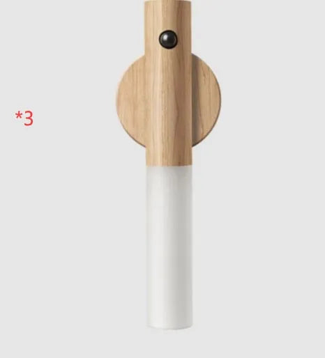 Compact wooden and acrylic motion sensor LED desk lamp on a desk