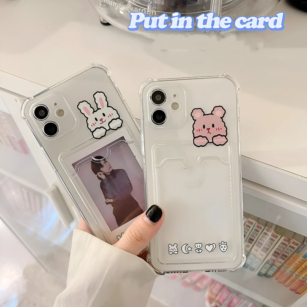 Clear cartoon design iPhone case with a card slot on the back, shown on a phone.