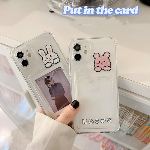 Clear cartoon design iPhone case with a card slot on the back, shown on a phone.
