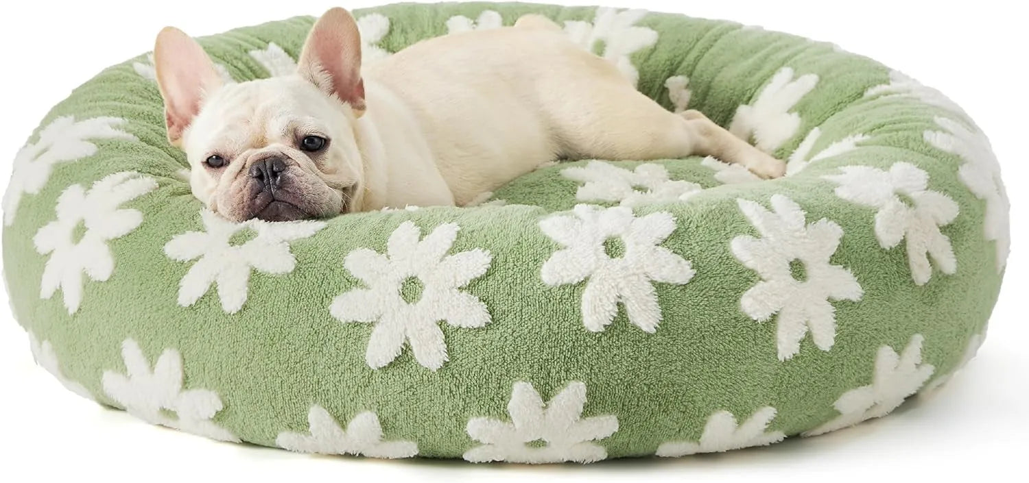 Round blue and white plaid dog bed with a removable cover on a plastic base.
