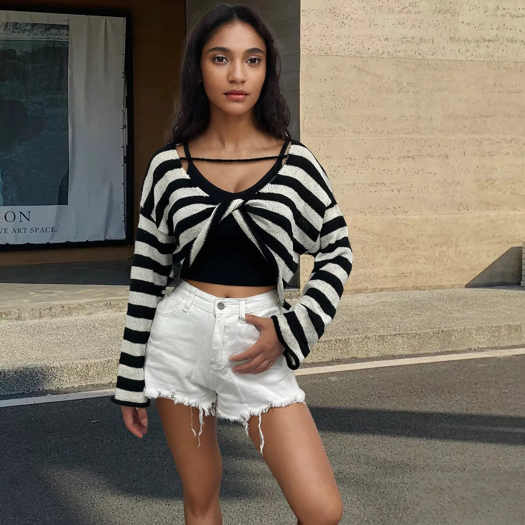 Striped long-sleeve women's pullover sweater in mercerised cotton showing exposed navel style.