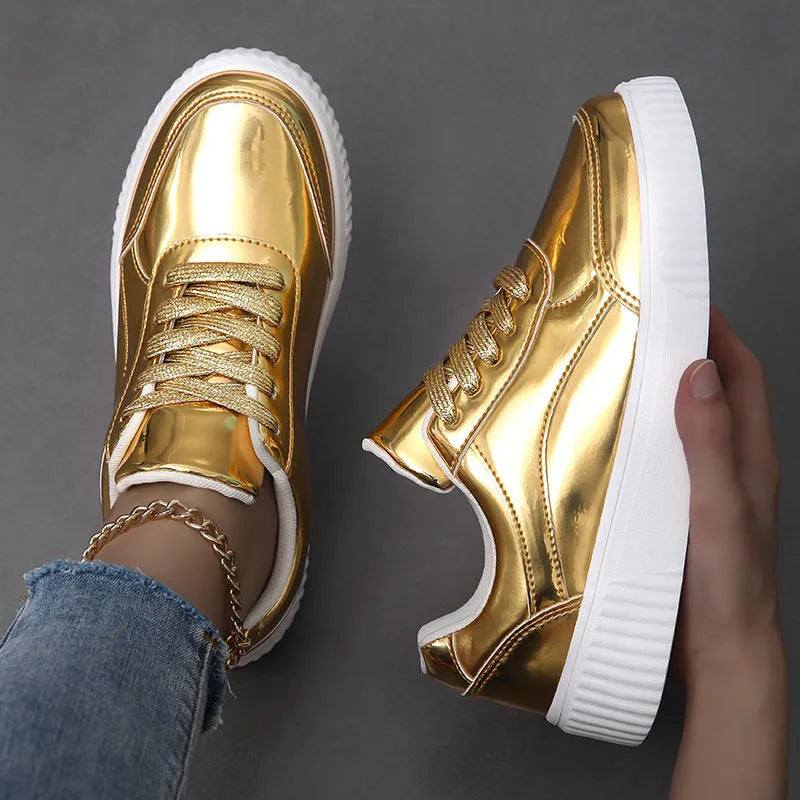 Rose gold sequinned platform sneakers with round toe and thick sole on a white background