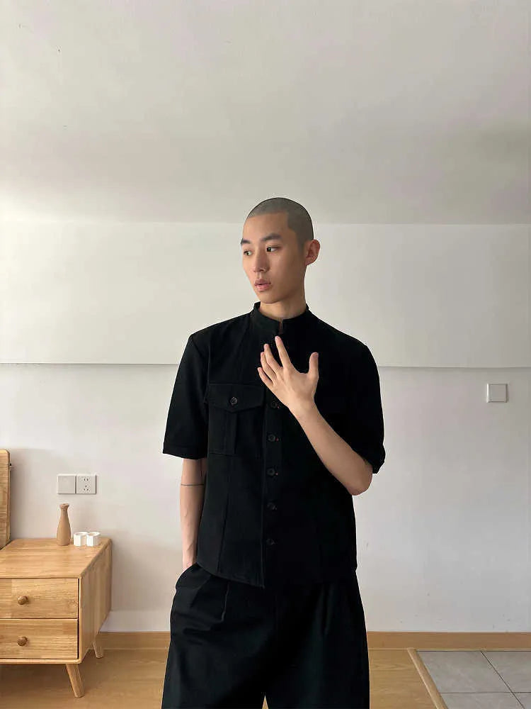 Handmade black half-sleeve hunting shirt with a shirt collar on a mannequin
