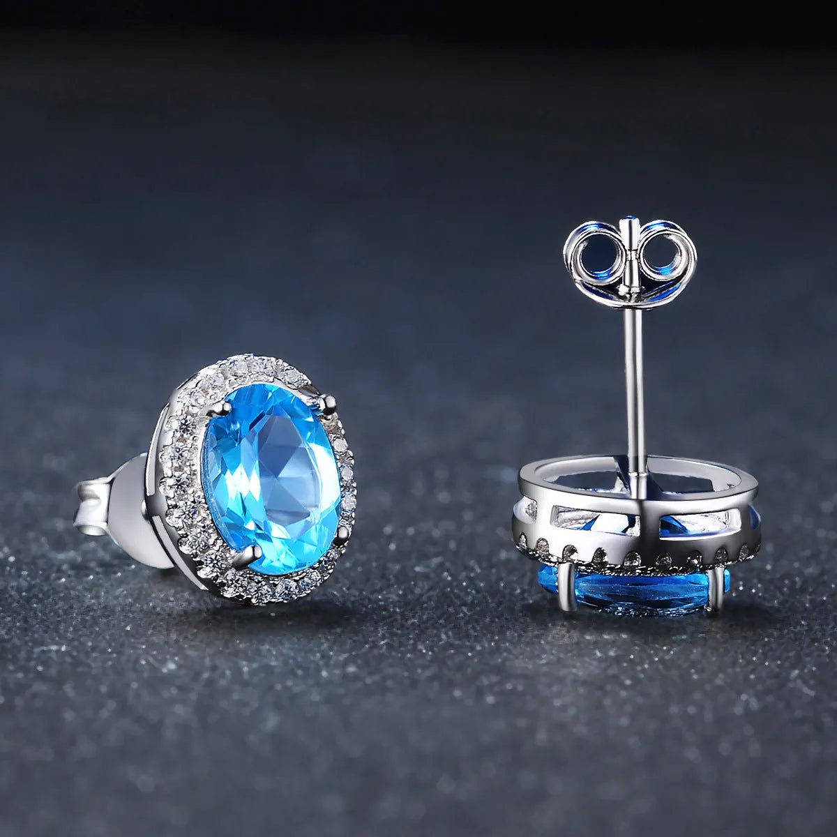 925 sterling silver jewellery set with blue topaz gems including earrings, ring, necklace and pendant