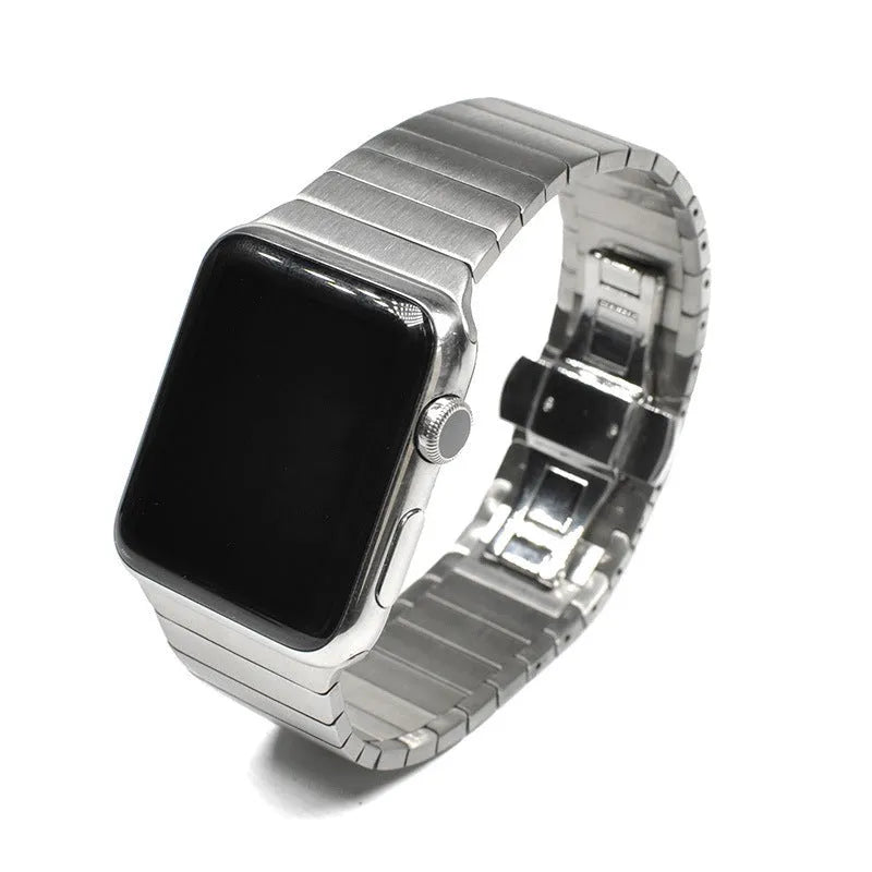 Silver metal Apple Watch band with butterfly clasp on a 40mm compatible watch case.