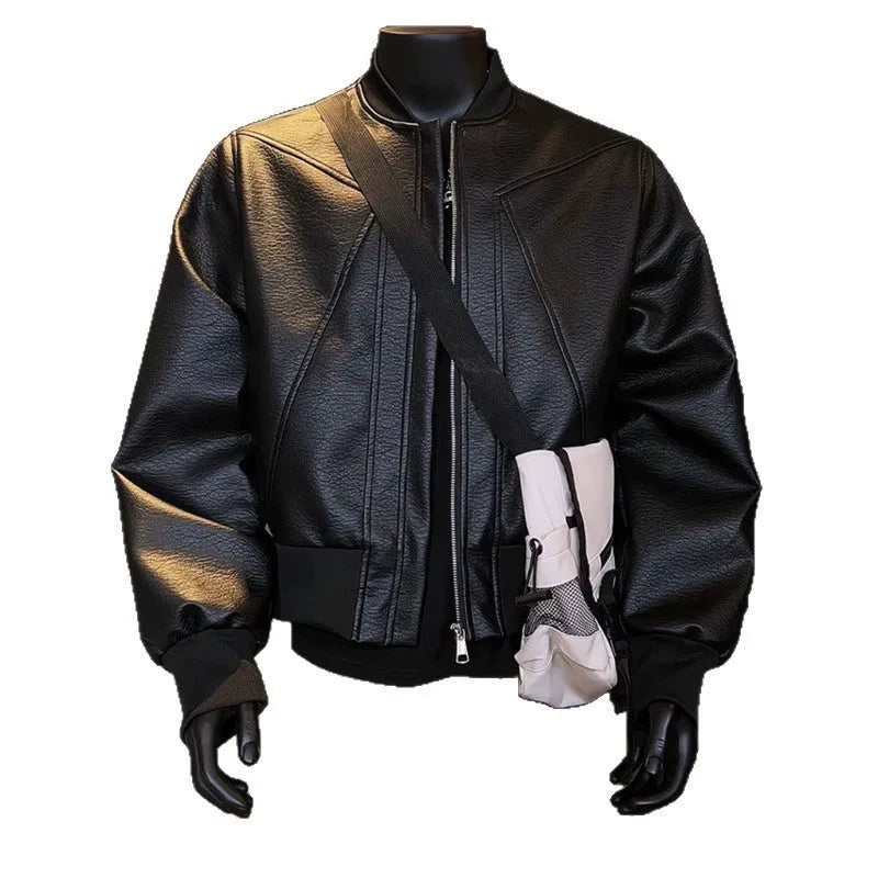 Man wearing a black slim-fit extended length PU leather jacket with a litchi pattern texture.