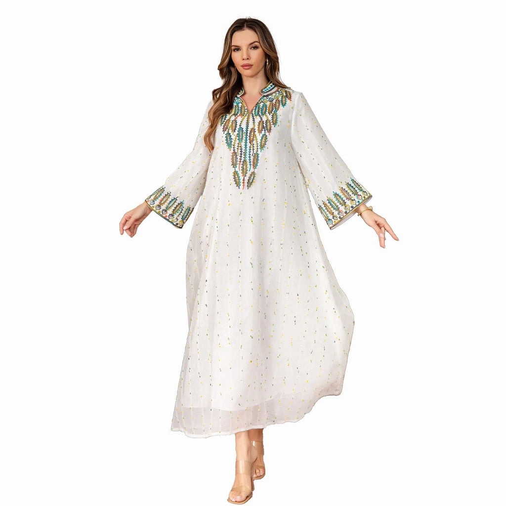 White long sleeve Arabic robe for women made from polyester, shown in a long skirt style.