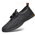 Men's black breathable mesh casual shoes with elastic band fastening and flat rubber sole