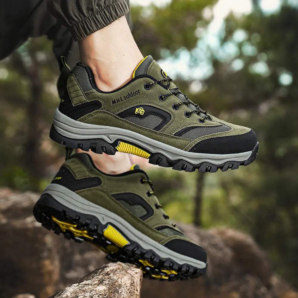 Men's waterproof non-slip mountain climbing sneakers soft bottom in army green on rocky trail