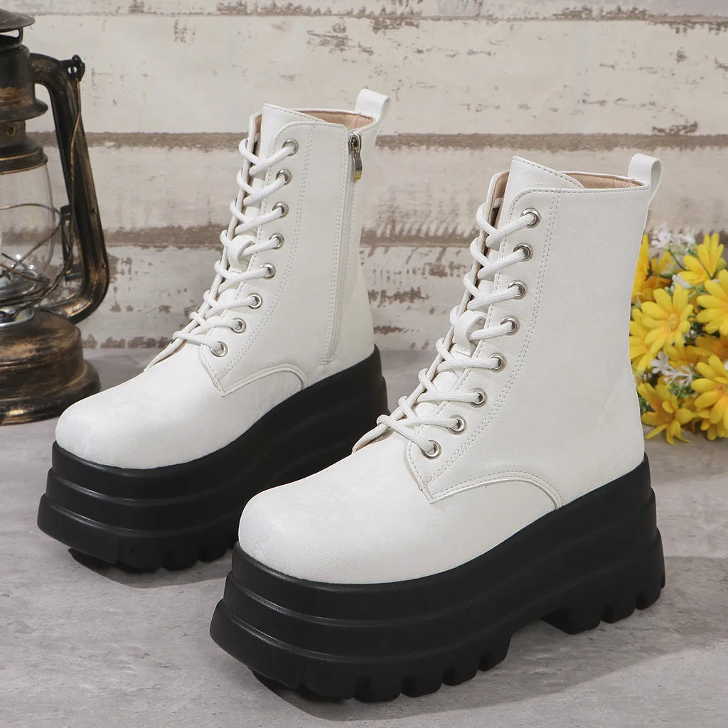 Women's black retro platform boots with patchwork design, chunky heel, and side zipper.