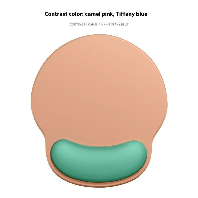Silicone mouse mat with attached gel wrist support in a gradient blue colour on a desk.
