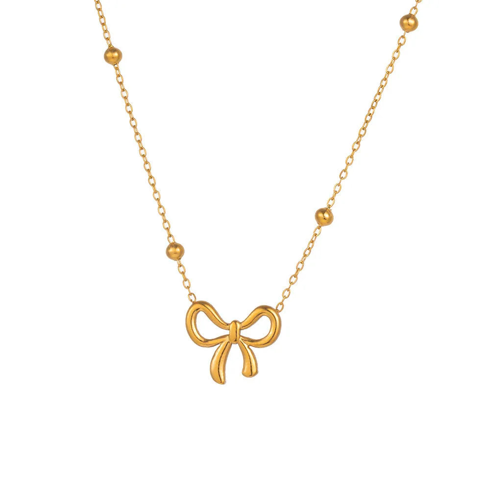 Gold bow necklace with cross chain links and adjustable 41-50cm length
