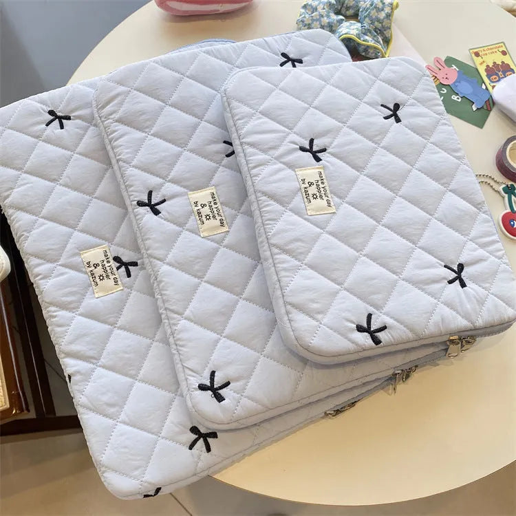 Notebook storage bag with rhombus embroidery and bow decoration in nylon fabric