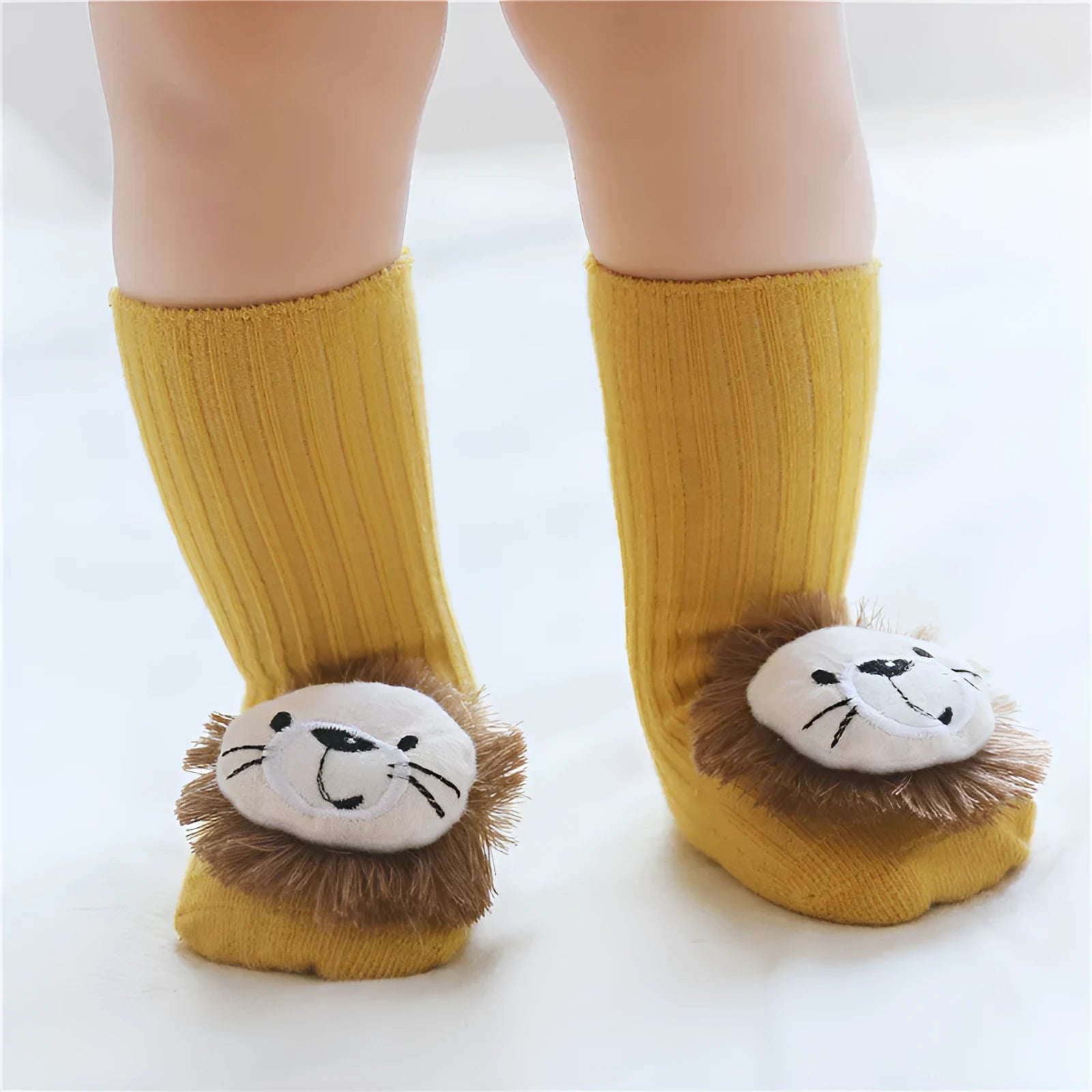 Cotton baby floor socks in various patterns including animal prints, stars, and bows for infants aged 0-3 months