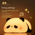 Cartoon panda-shaped night light with soft silicone construction and warm white LED glow