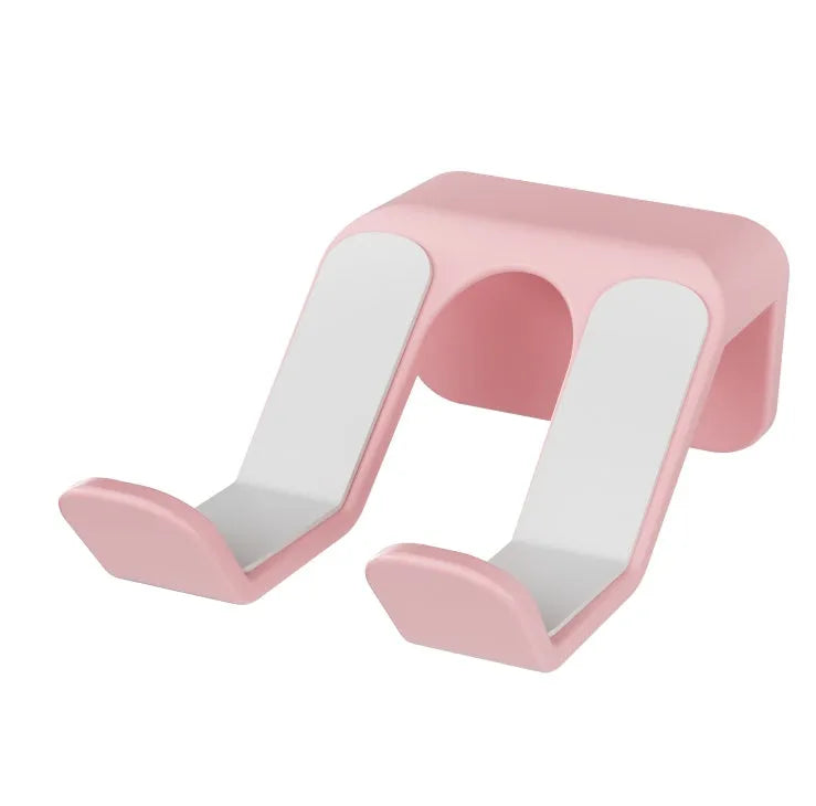 Black ABS plastic universal wall-mounted hanging rack holding a game controller and a gaming headset.