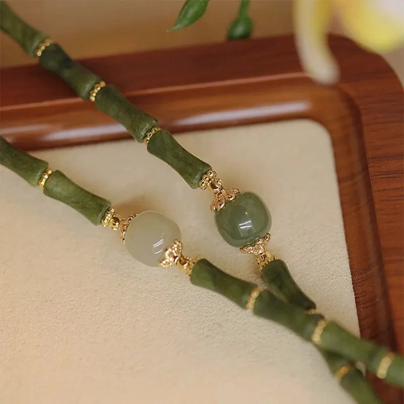 Simple geometric Hetian jade bracelet for women with round beads in dark green and light colour options.
