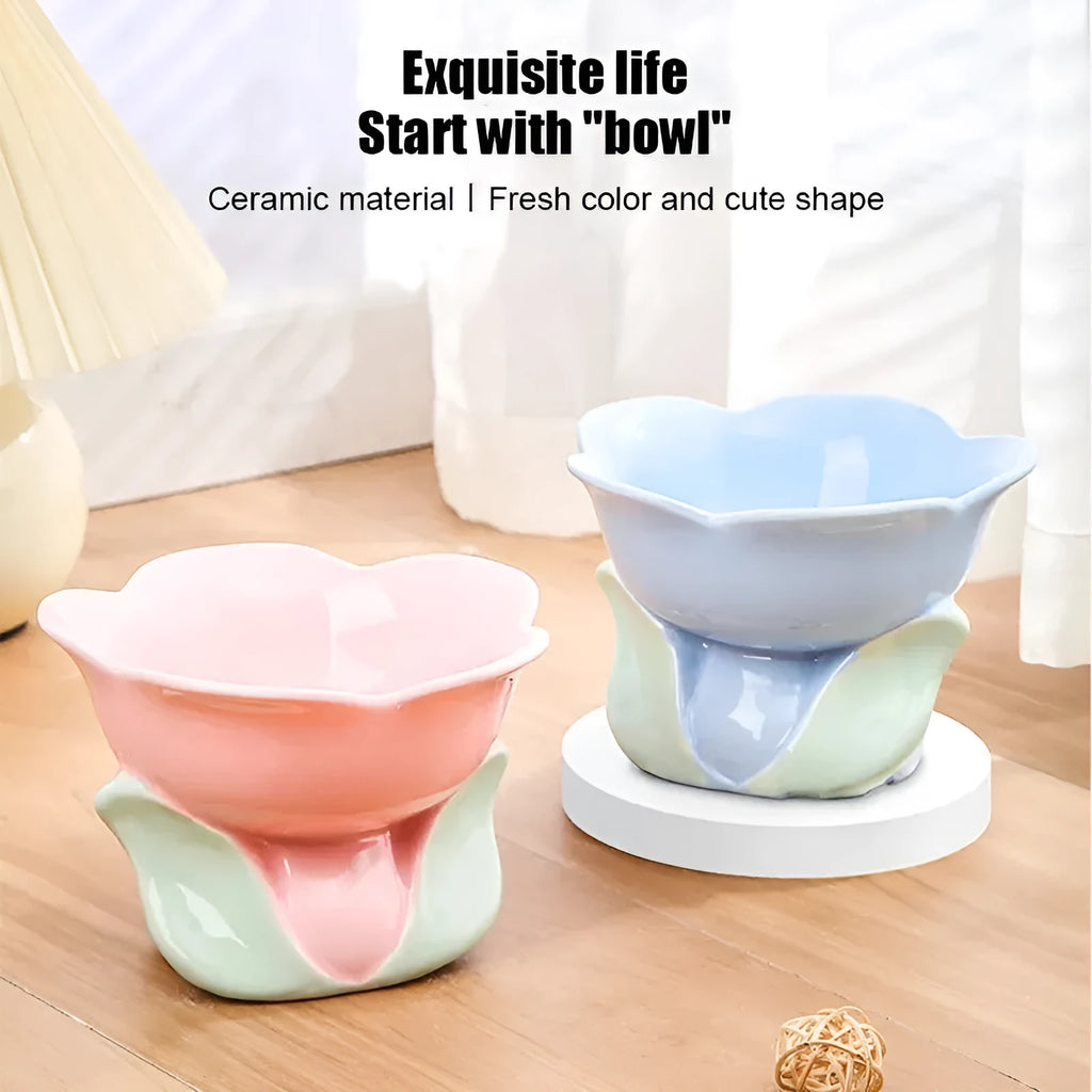 Blue floral patterned raised ceramic pet bowl for cats and dogs on a non-slip base.