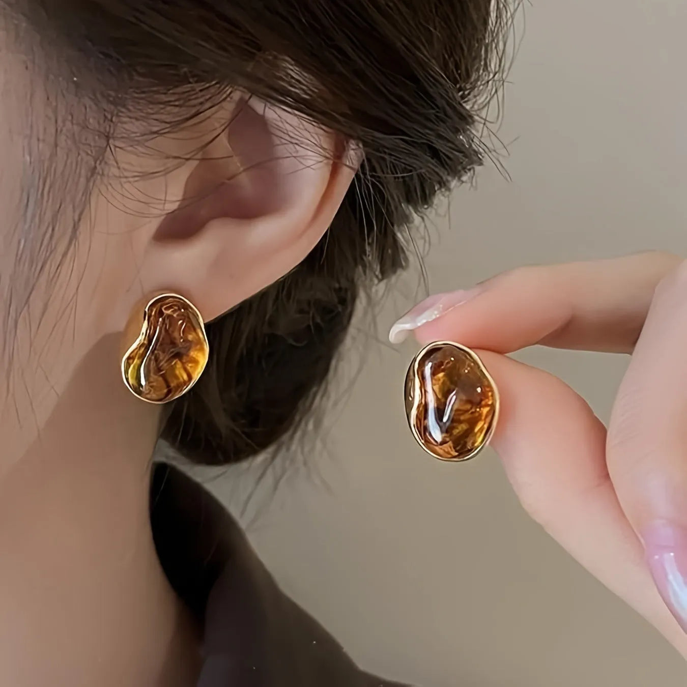 Three pairs of handmade geometric women's earrings with electroplated finishes and tassel details