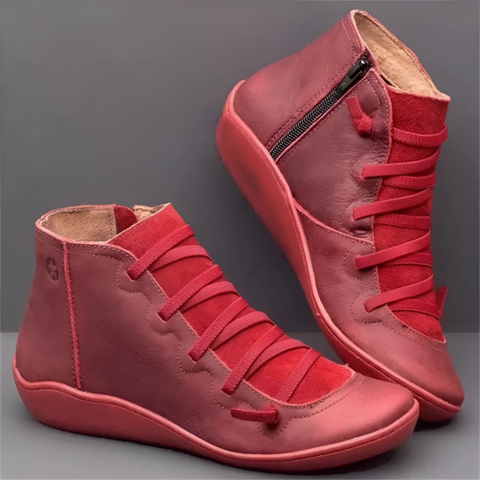 Women's flat wedge heel ankle booties in various colours including leopard print, with round toe and rubber sole.