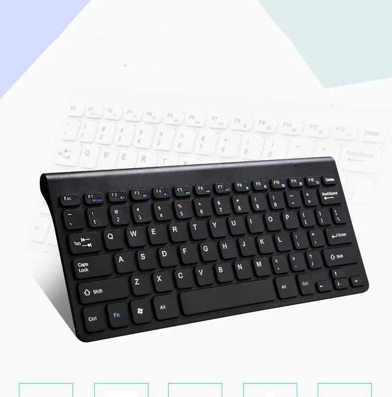 Black and white wireless keyboard and mouse set with USB receiver on a desk.