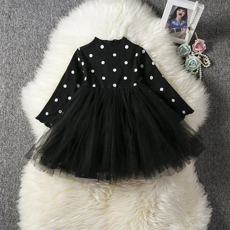 Baby girl wearing black lace tutu dress with long sleeves for birthday party